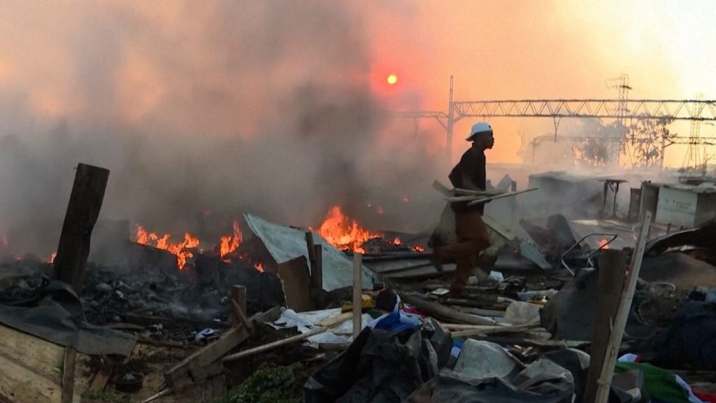 rewrite this title in Arabic Video. Johannesburg neighbourhood devastated by fire