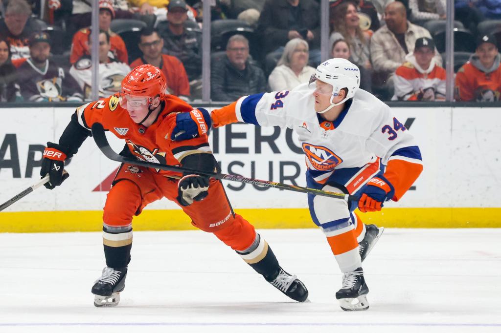 rewrite this title in Arabic Defenseman Adam Boqvist skates at center with Islanders in a lineup crunch