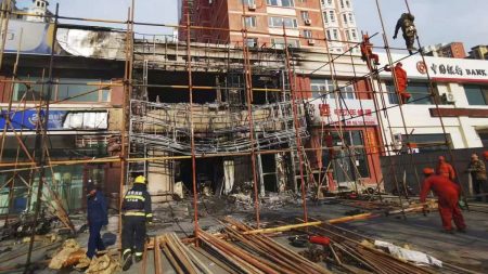 rewrite this title in Arabic At least 22 people killed in restaurant fire in China’s Liaoyang, officials say