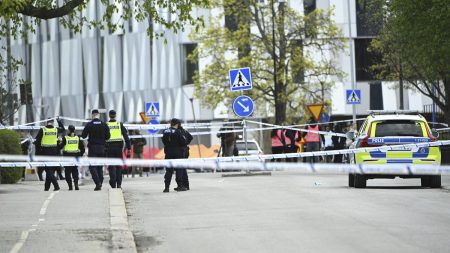 rewrite this title in Arabic Three dead in Uppsala shooting, Swedish police launch investigation