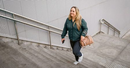 female walking stairs 1200x628 facebook