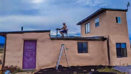 offgrid1 featured image eric on roof