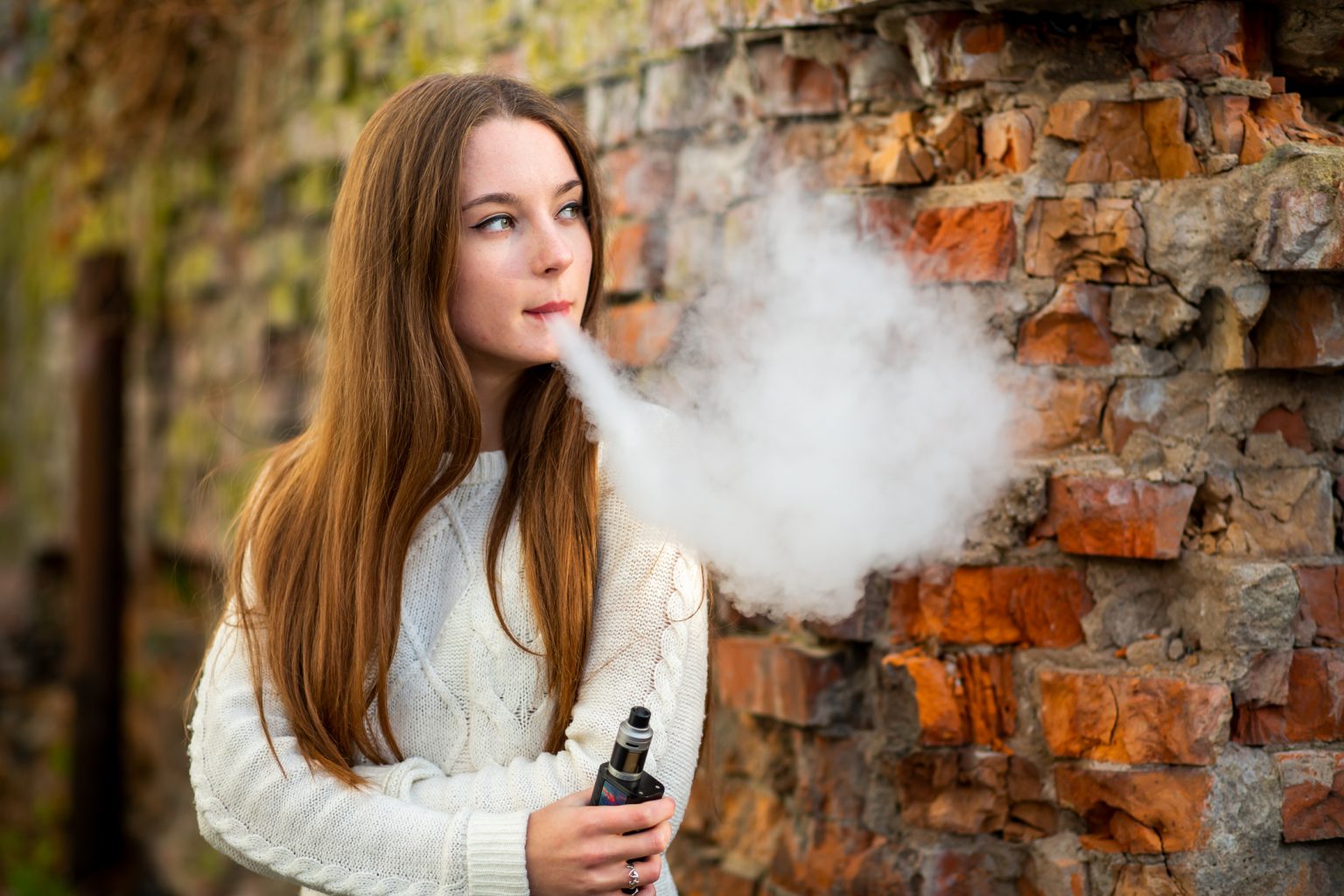 young girl vaping