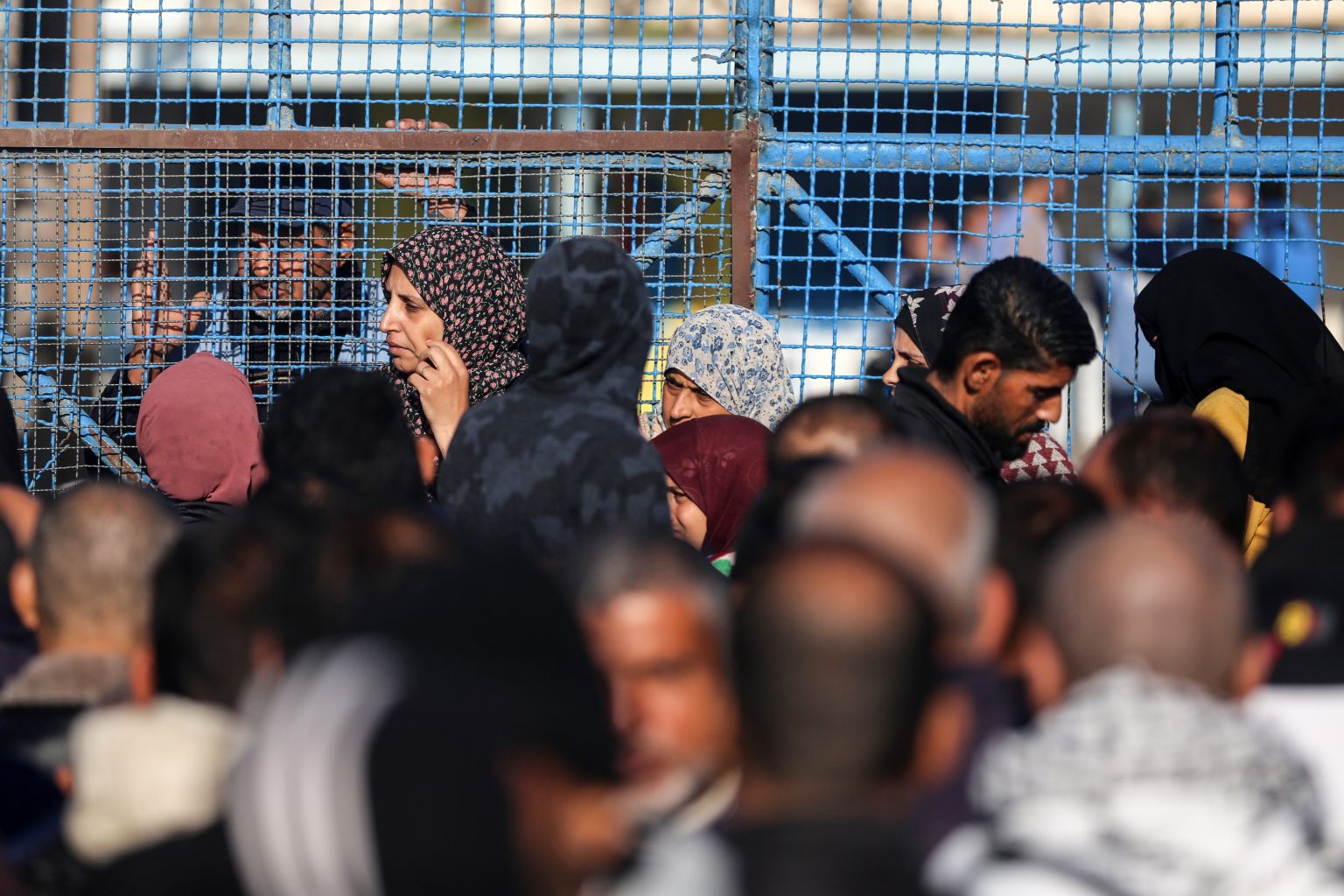 Palestinians line up to receive supplies in Deir al Balah