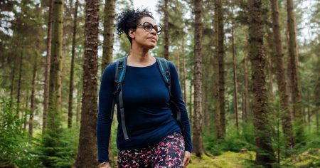 female walking woods 1200x628 facebook