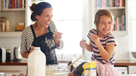 little girl in the kitchen with her mother