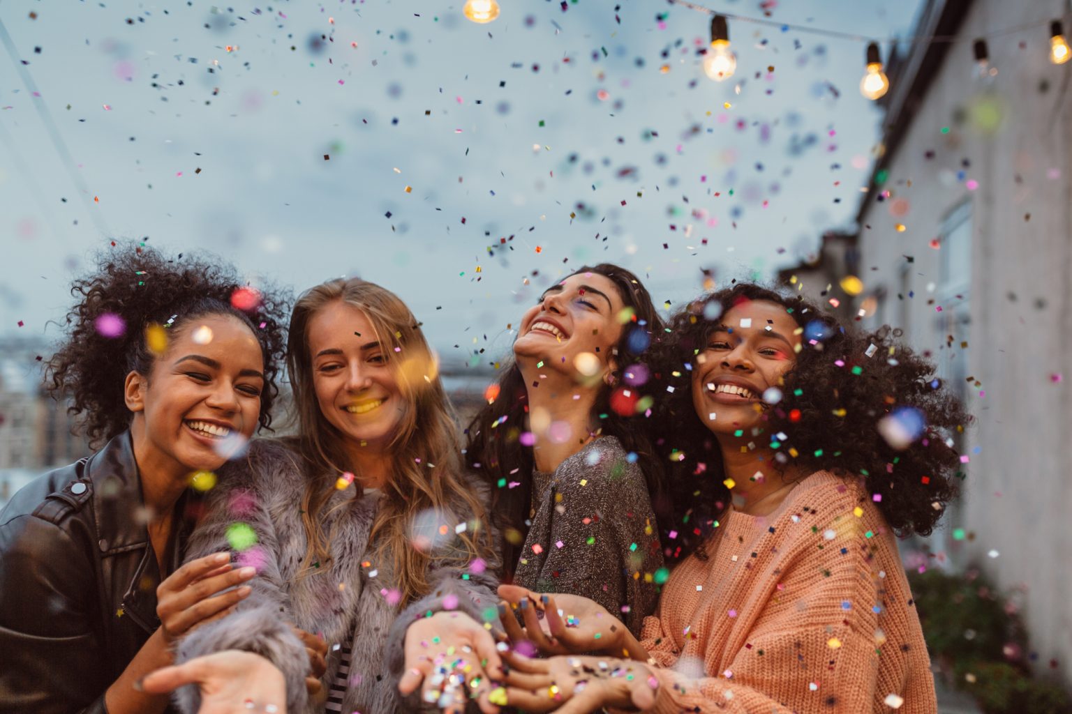 group friends under confetti