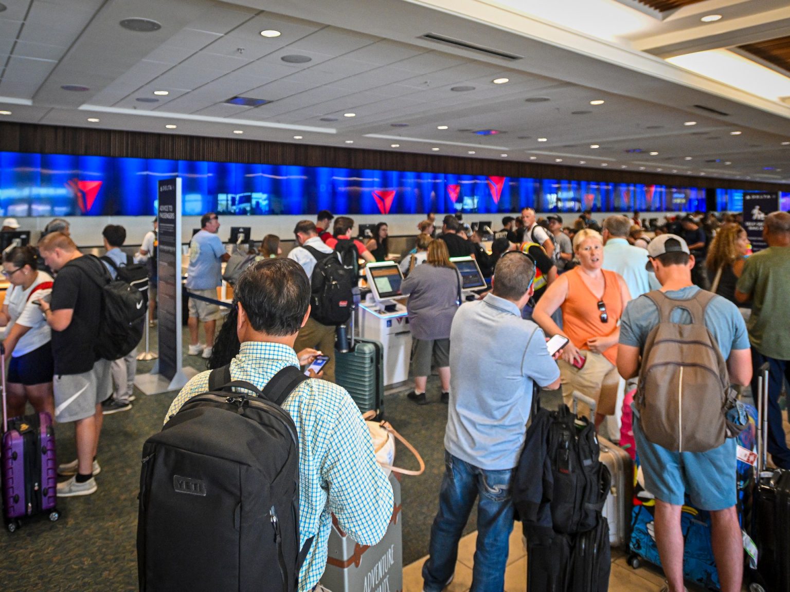 rewrite this title Slow recovery after CrowdStrike update sparks global IT outage AFP 20240720 2162061849 v1 HighRes MajorItOutageGroundsFlightsAndImpactsBusines 1721457435