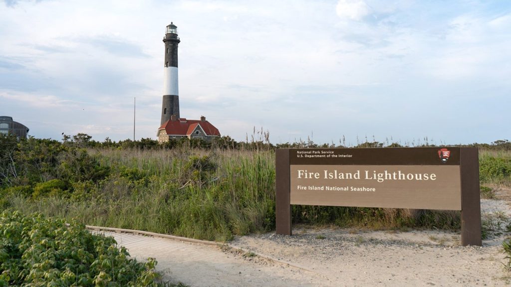 FI Lighthouse and NPS Sign Dusk