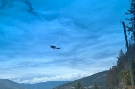 Helicopter bucketing water Mara Lake