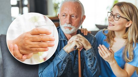 elderly man healthcare worker shaky hand