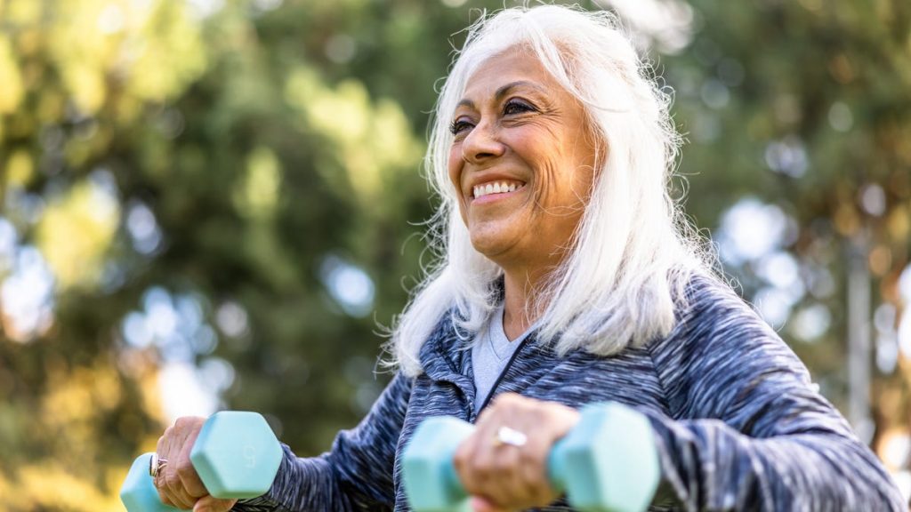 older adult lifting weights