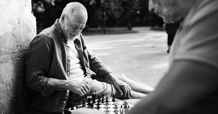 older male playing chess 1200x628 facebook