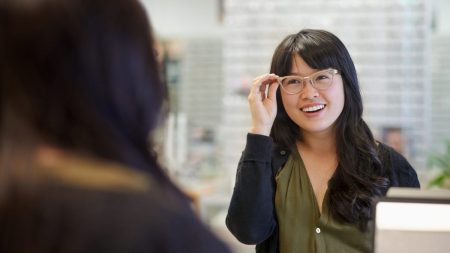 person trying on glasses