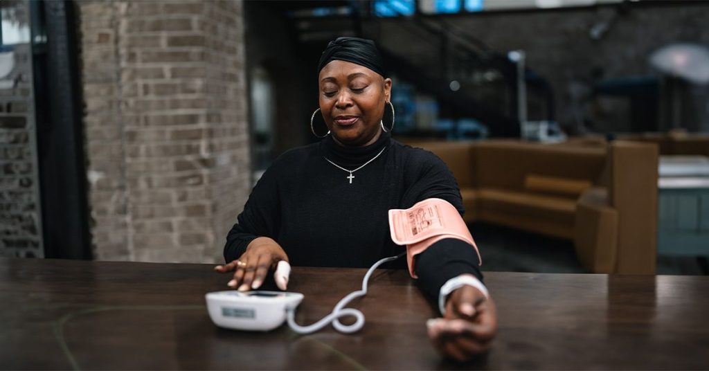 woman using blood pressure monitor 1200 628 facebook