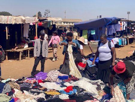 Customers go through a pile of clothes at Mbare market ish Mafundikwa 1726921993