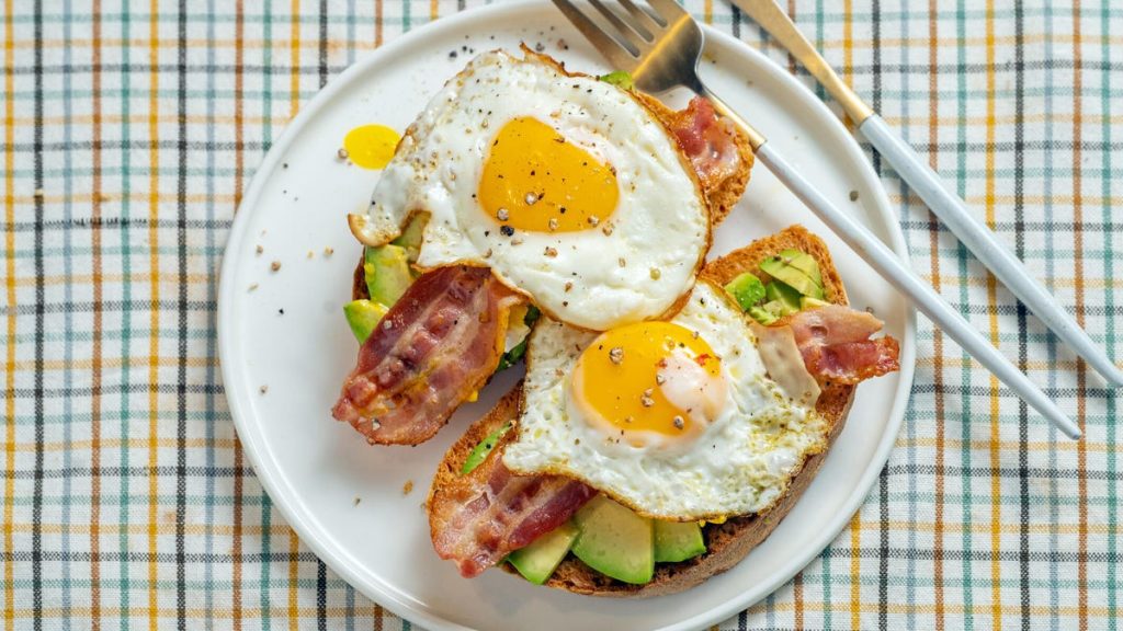 egg bacon avocado toast on plate