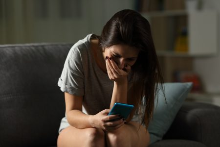 stock image woman sad phone