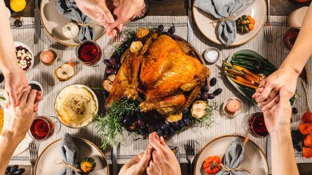 family around table at Thanksgiving