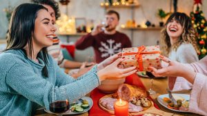 exchanging christmas gifts over food