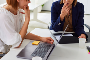 woman table discussing money