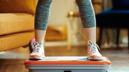 person exercising on vibration plate