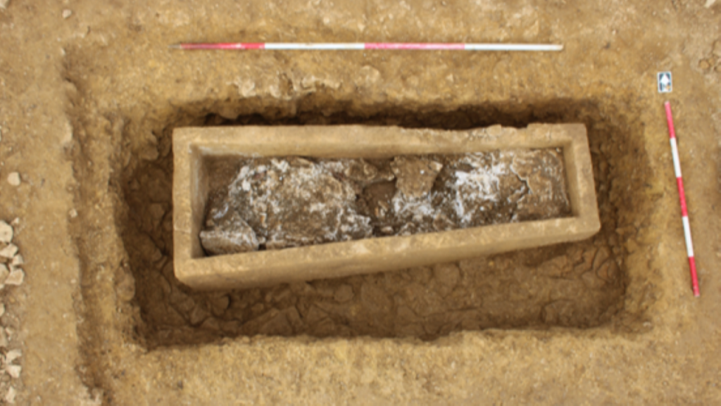 the roman stone coffin under excavation