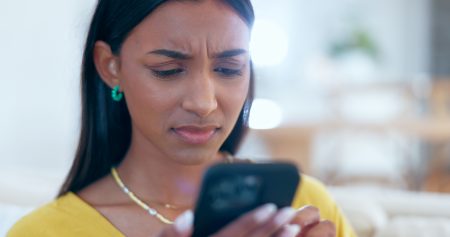 woman looks upset phone