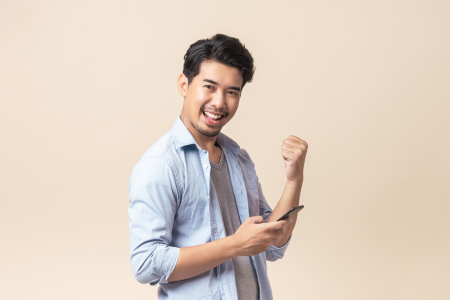 young man formal shirt brown background smartphone