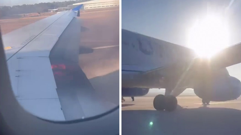 view of plane wing catching fire during takeoff at houston airport