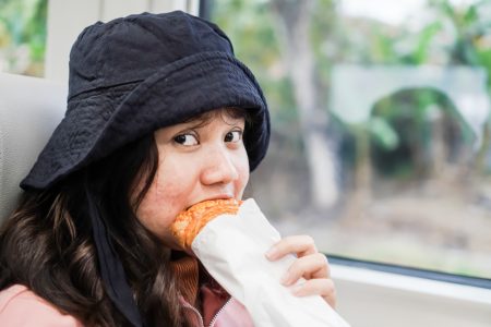 woman eating train stock image