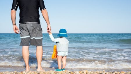 a9859524 father and son at beach