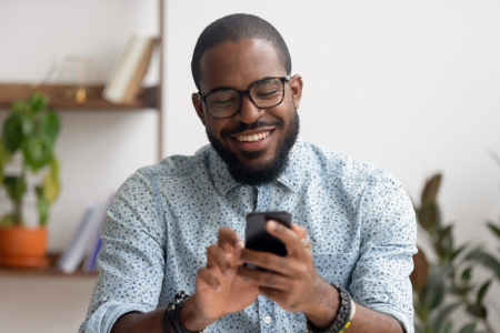 stylish businessman glasses uses mobile phone office