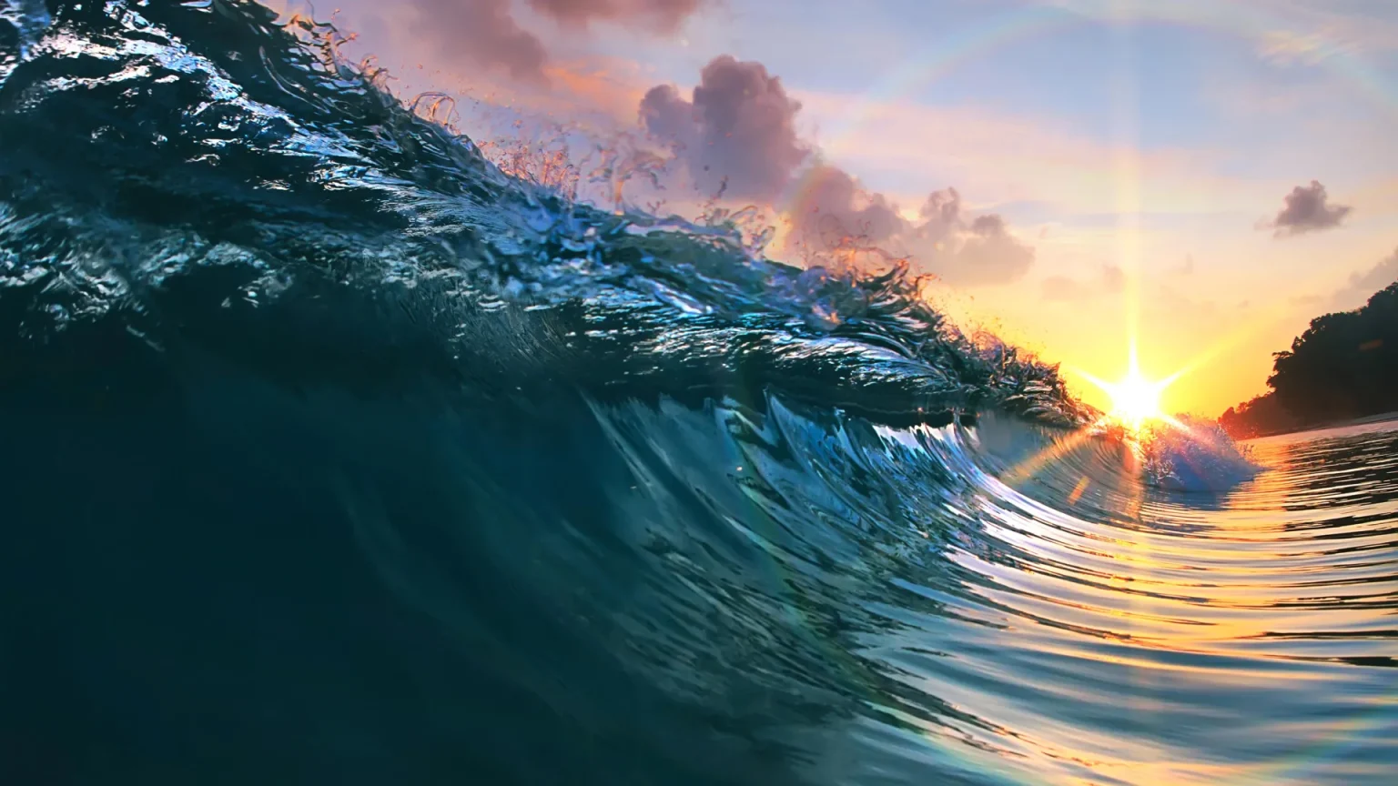 breaking wave sunset.webp