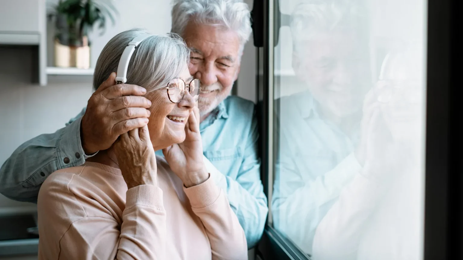 happy senior couple listening.webp