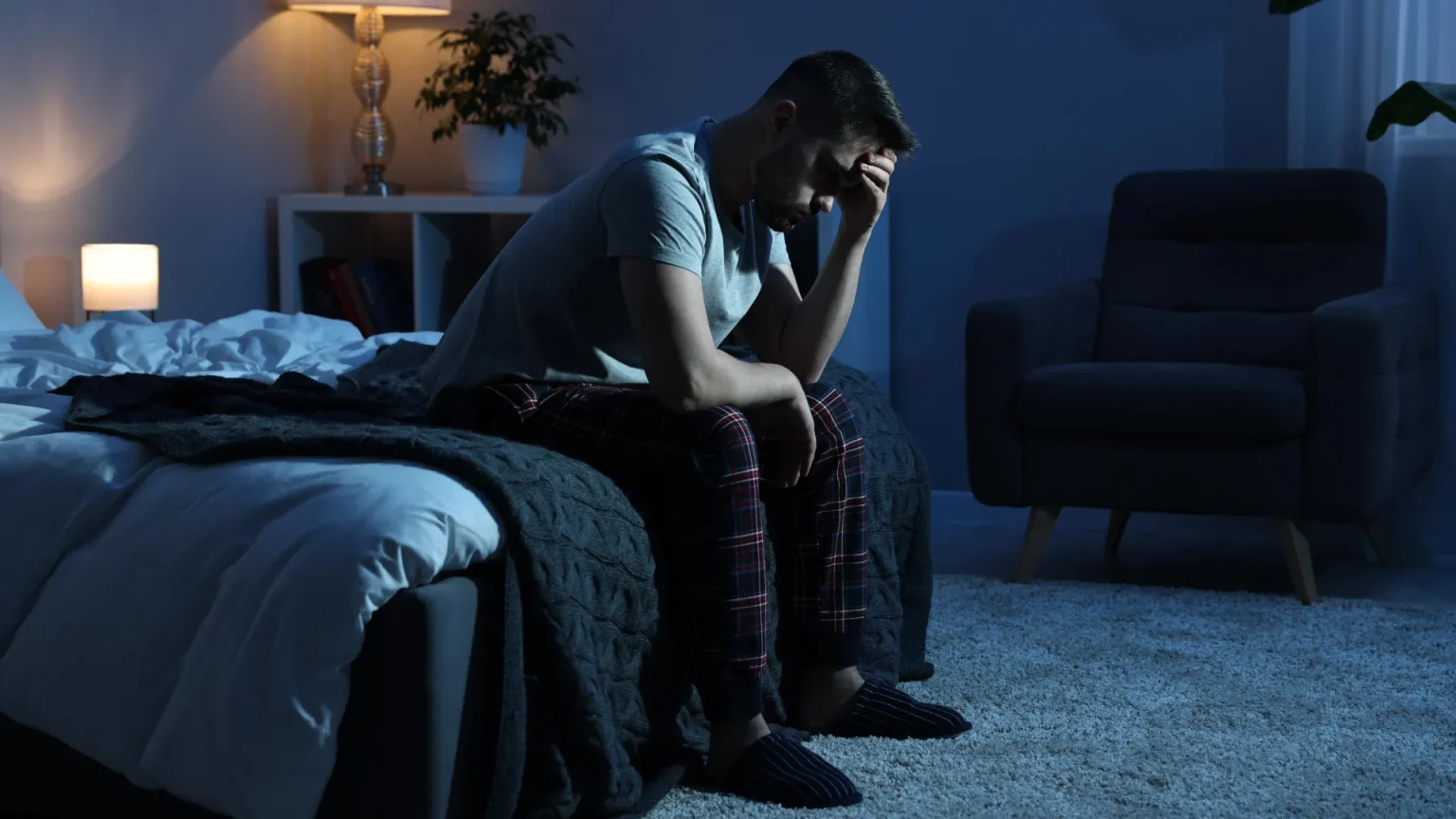 insomnia man bed frustration.webp