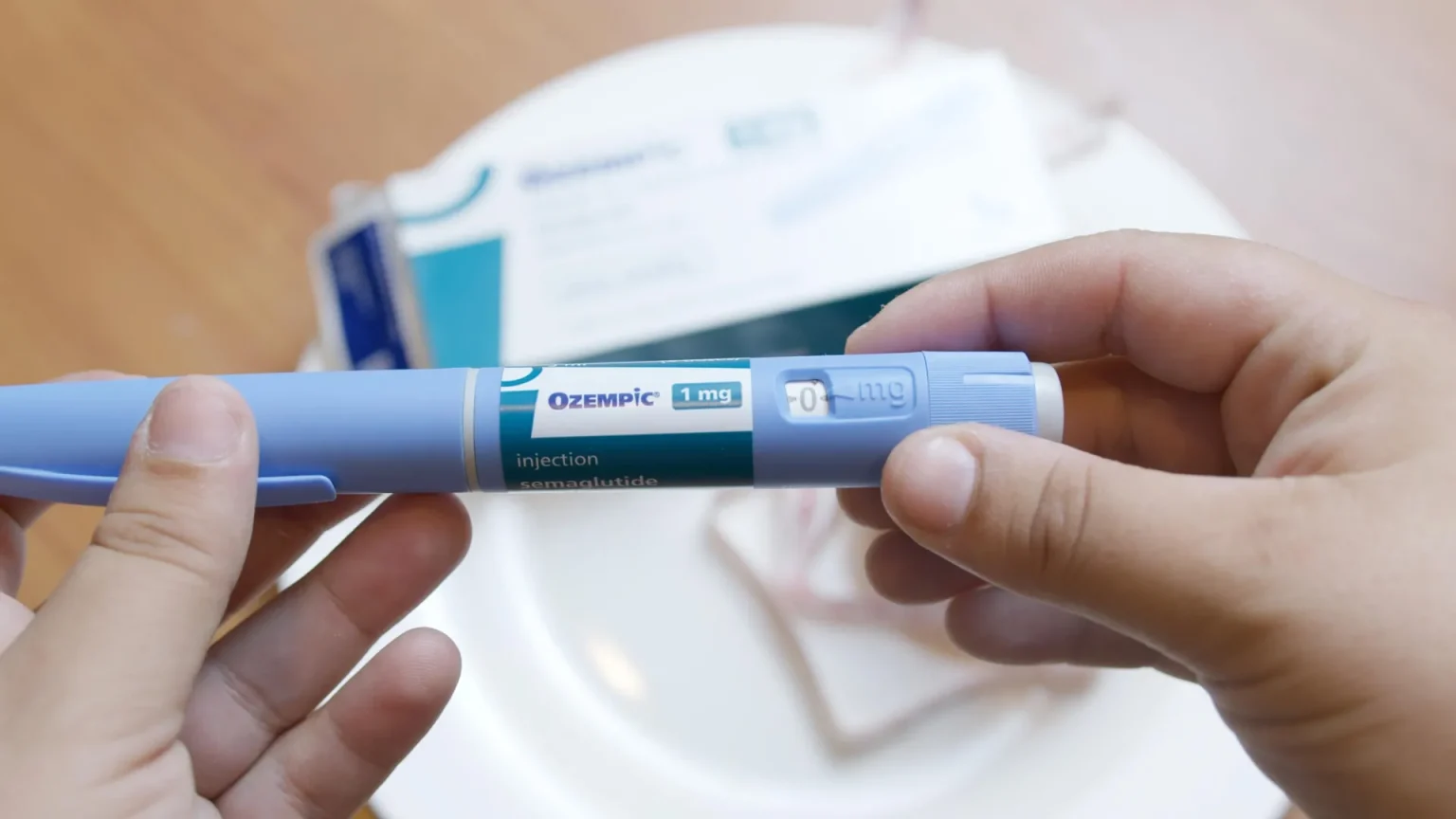 semaglutide ozempic injector pen in hands.webp