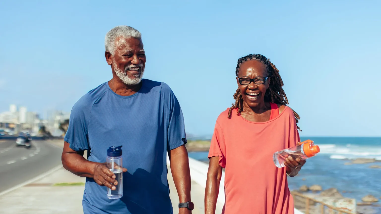 smiling older black couple walking.webp