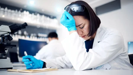 Array female scientist stress anxiety headache.webp