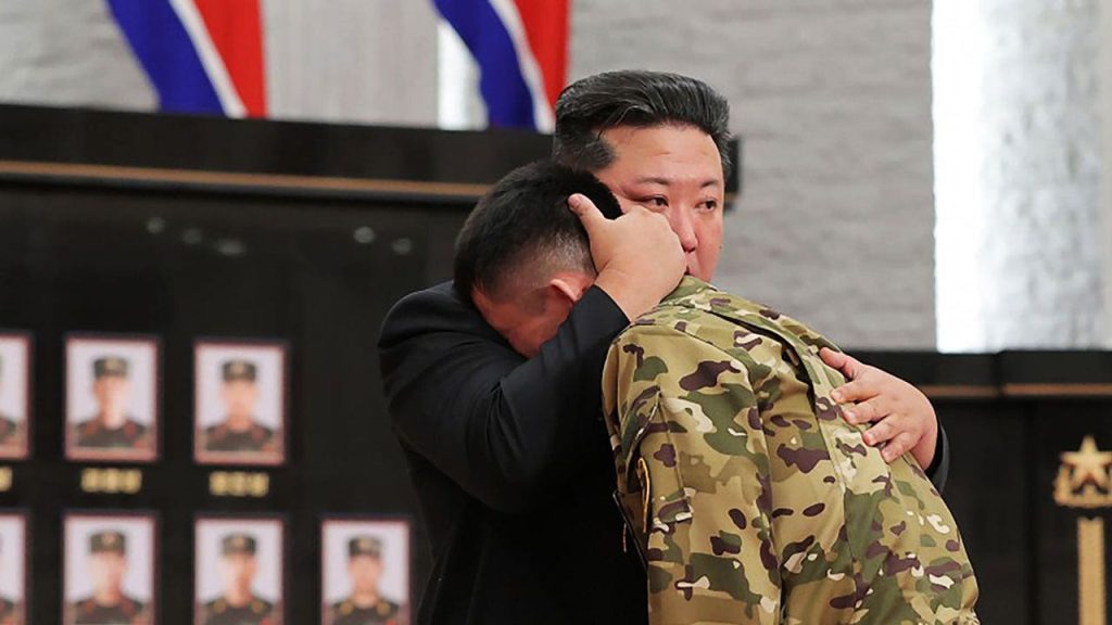 kim hugs soldier