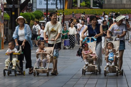 women push toddlers strollers chongqing
