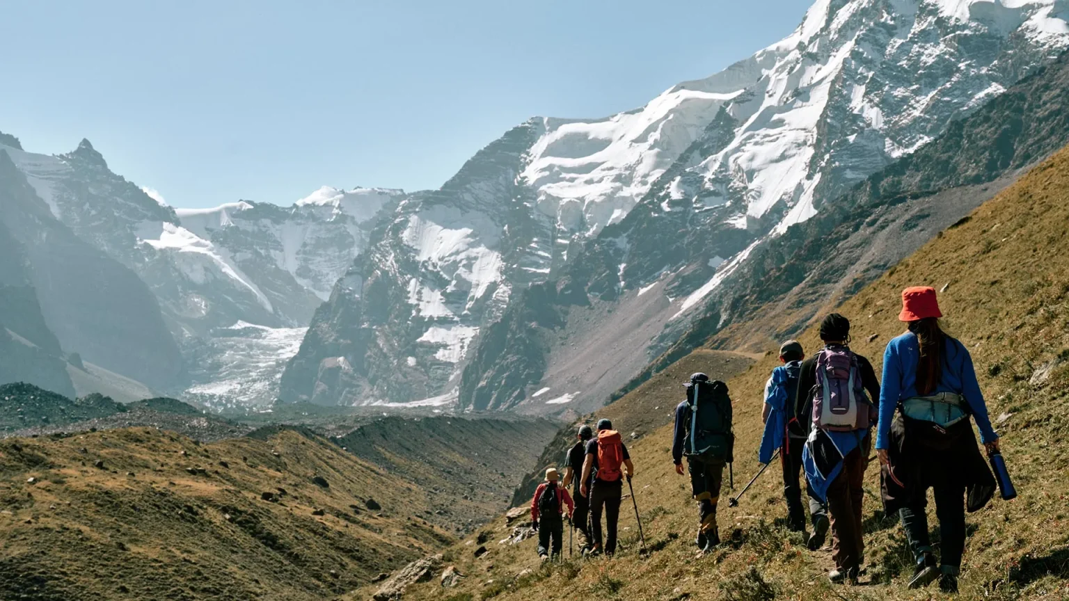 field team walks toward kyzylsu glacier in pamir mountains.webp