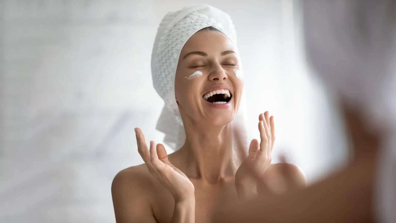 happy woman face skin cream.webp