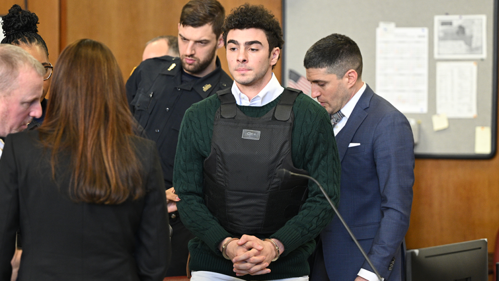 mangione in court with vest on