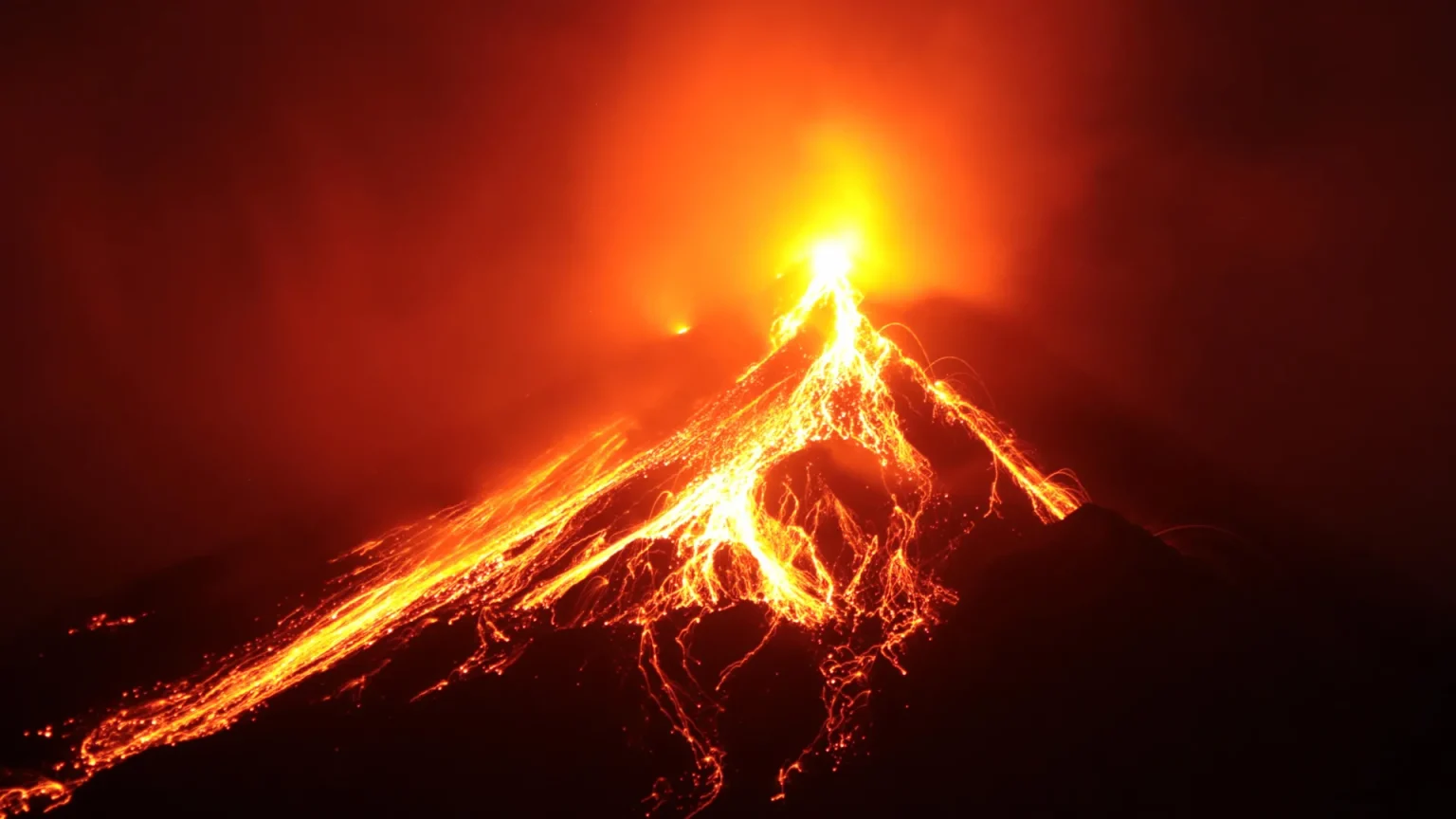 volcano erupting at night lava flow.webp